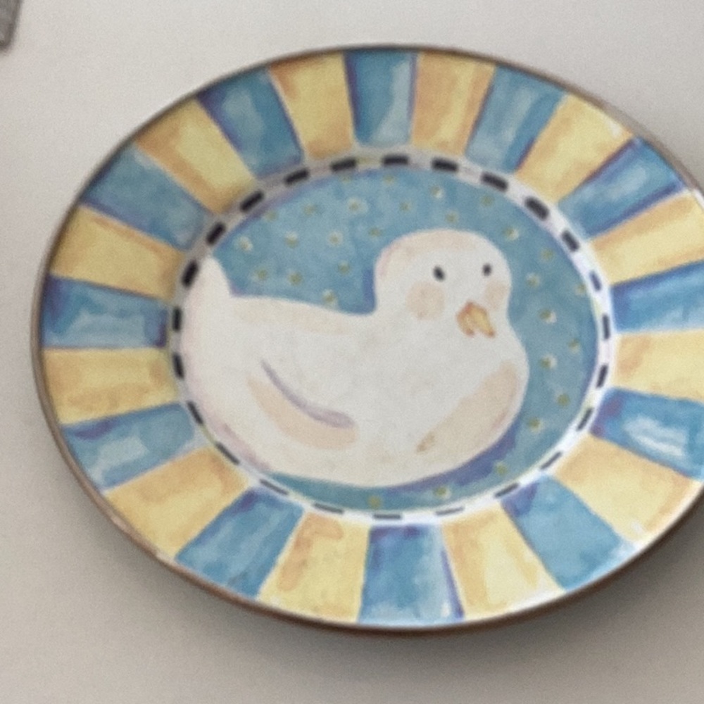 A set of 4 metal dessert plates featuring cute animals from MacKenzie Childs